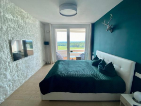 ALPEN-PANORAMA SUITE - Einzigartige Privatsuite hoch über München, 12tes OG, Alpenblick, Loggia, Whirlpool, 15 Minuten zum Zentrum, Ruhe und Erholung in der Stadt München für privat und geschäftlich R
